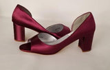 a pair of burgundy low heel block shoes with a peep toe front