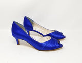A pair of royal blue satin kitten heel shoes with a peep toe