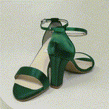 A pair of hunter green block heel shoes with an ankle strap