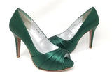 A pair of high heeled hunter green satin shoes with a peep toe and a hidden platform at the front of the shoes