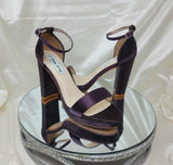a pair of high heel block shoes dyed eggplant purple with a front toe strap