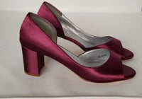 a pair of burgundy low heel block shoes with a peep toe front