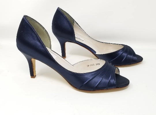 A pair of navy medium height heel shoes with a peep toe