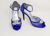 blue lace wedding shoes with crystal applique on the front of the shoes