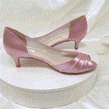 A pair of dusty rose low heel satin kitten heel shoes with a peep toe