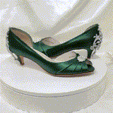 A pair of hunter green satin kitten heels with a peep toe and designed with a crystal design on the front of the shoes and a large crystal design on the back heel of the shoes