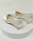 A pair of ivory low heel satin kitten heel shoes with a peep toe