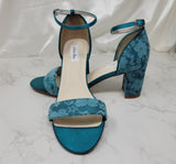 A pair of oasis lace covered low block heel shoes with an ankle strap 